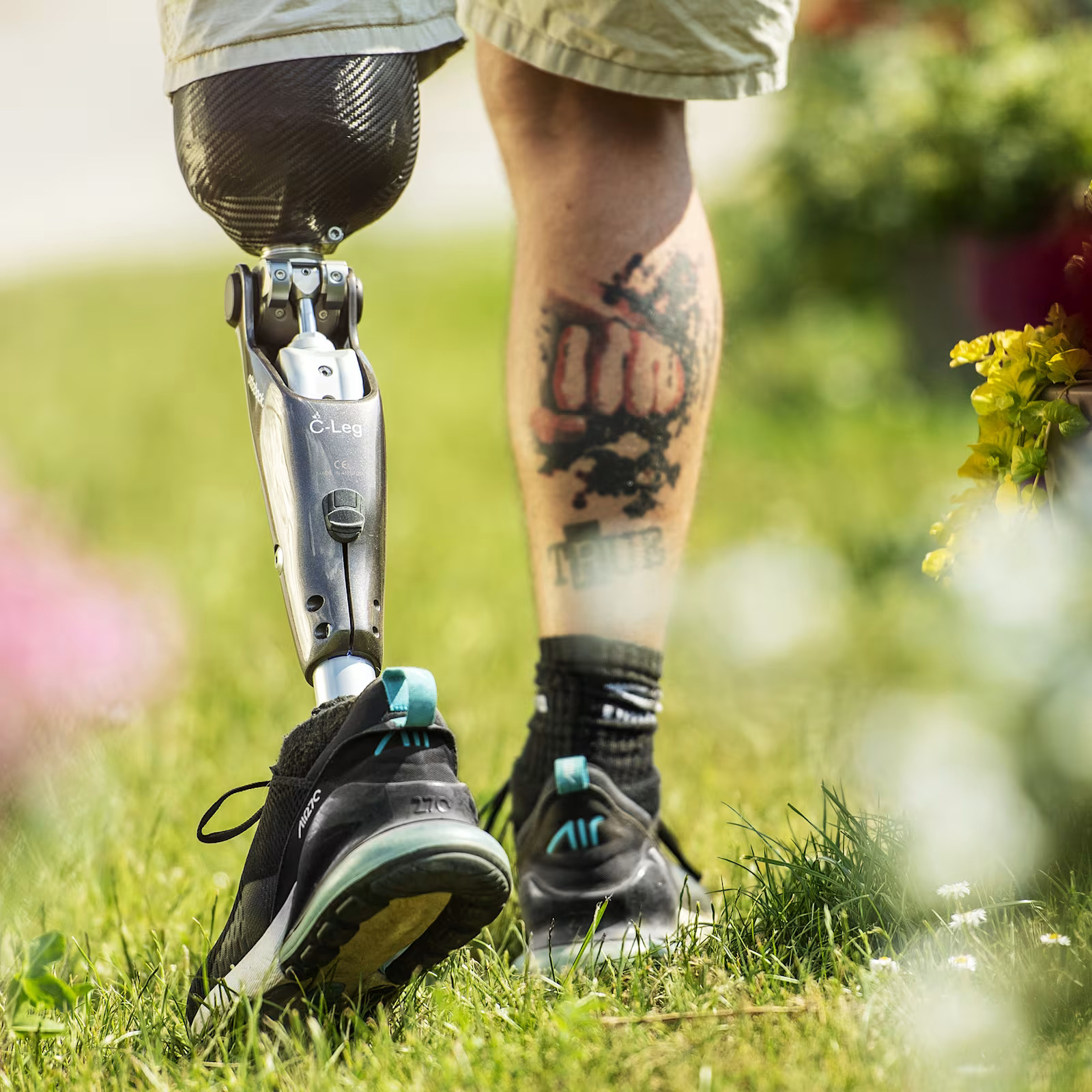 Prosthetic leg user walking outdoors